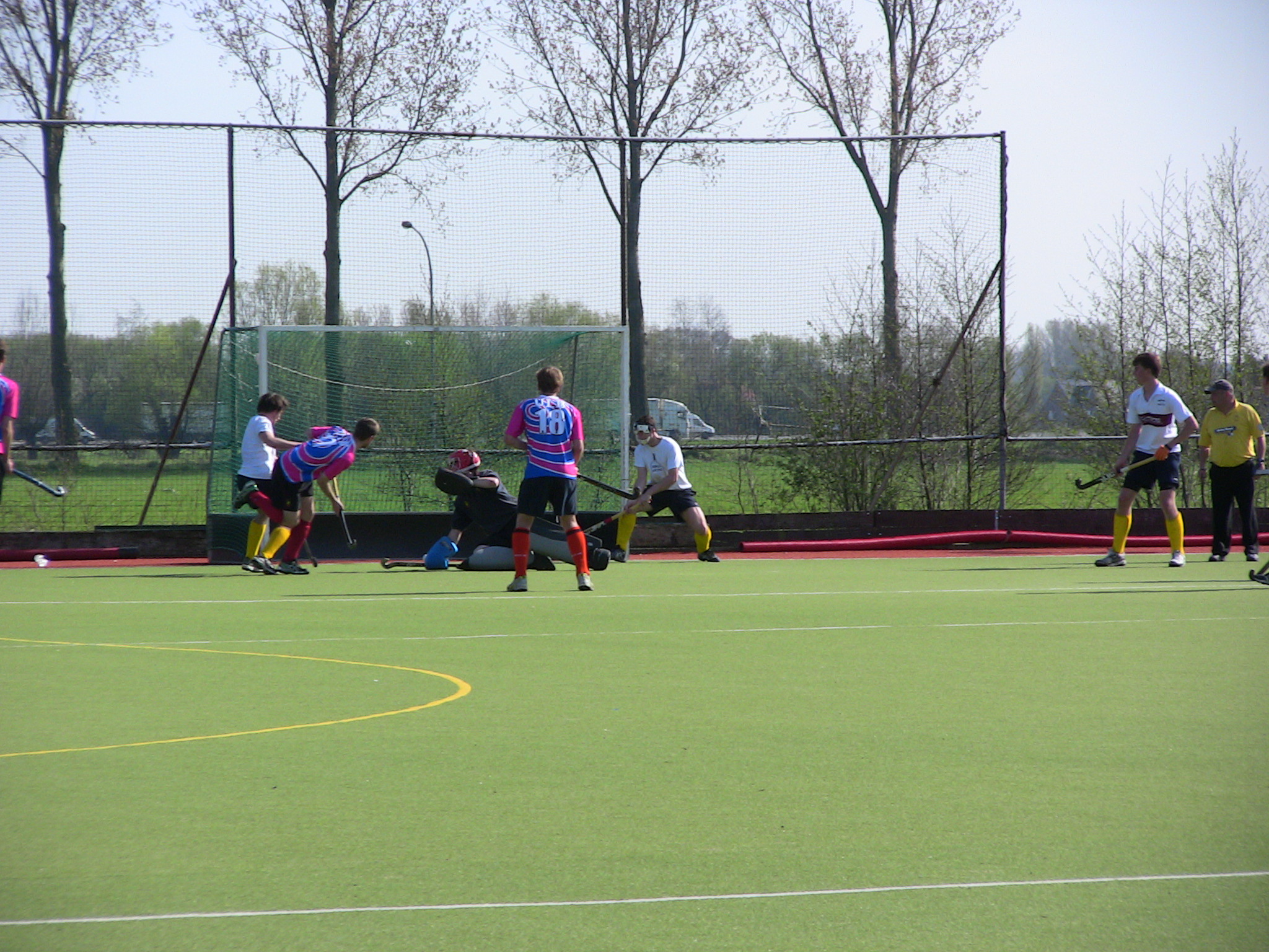 a group of people on a field playing soccer