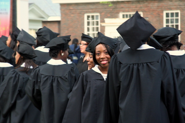 a group of graduates are standing and smiling