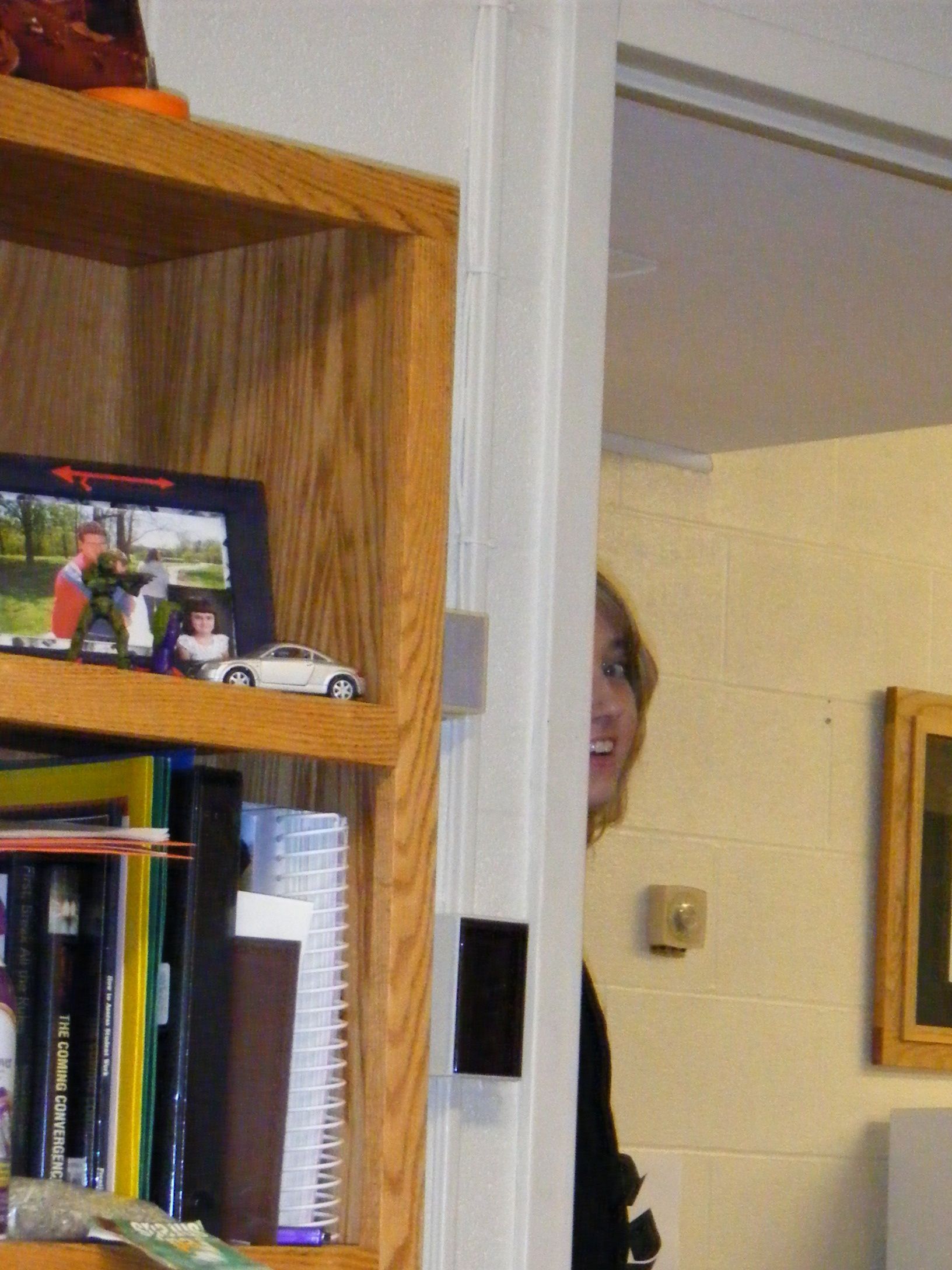 a woman looking into a room filled with books