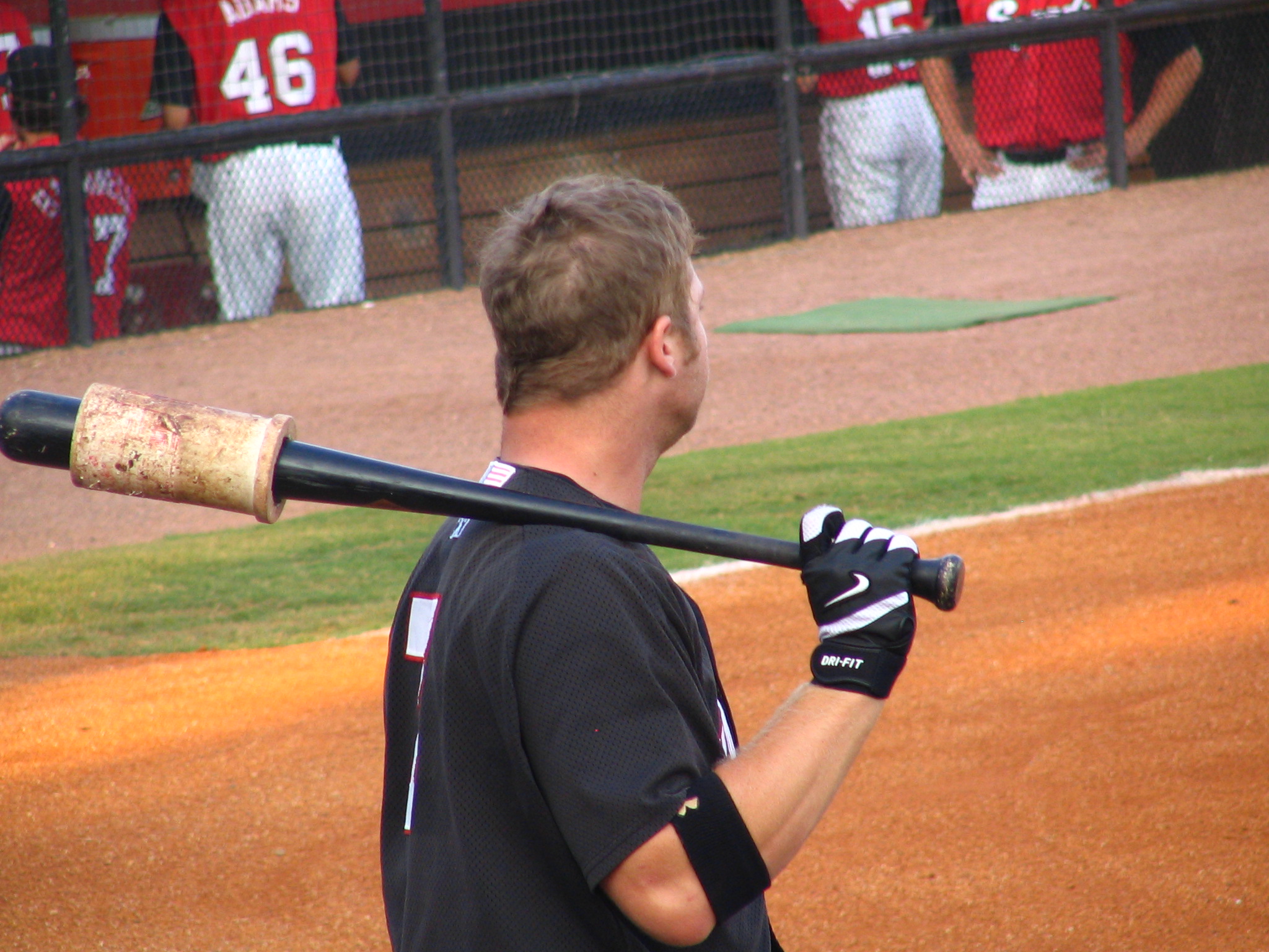 there is a baseball player standing with his bat on his shoulder