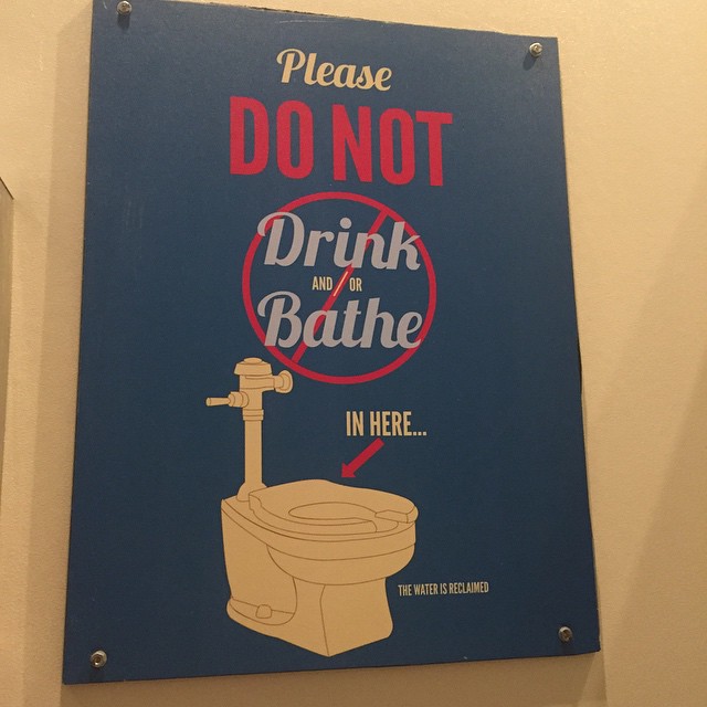 a blue sign that reads, please do not drink or bah - e in here