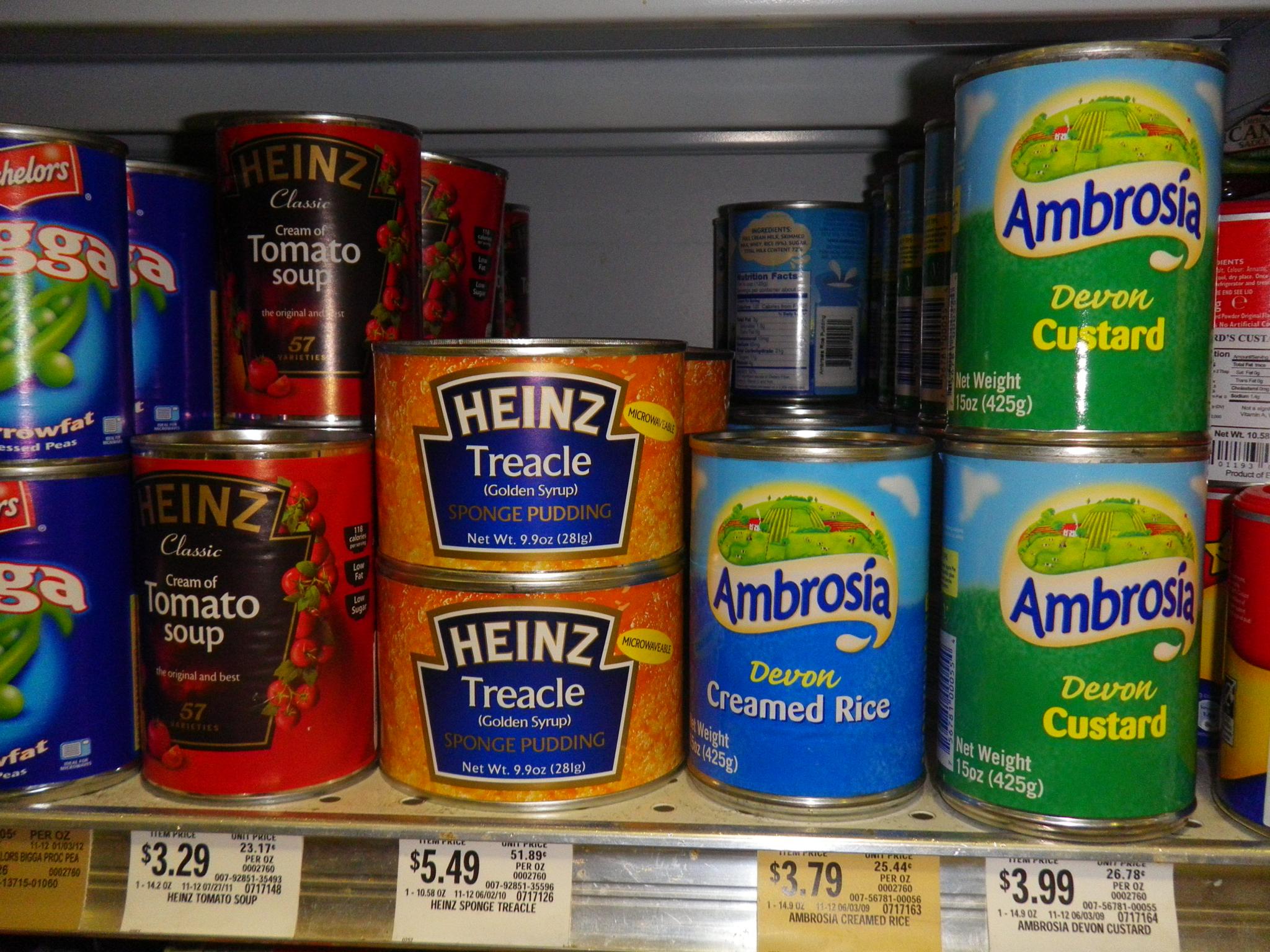 canned cans of soup sitting on the shelves