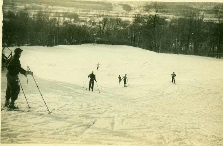 skiers going down the side of a hill