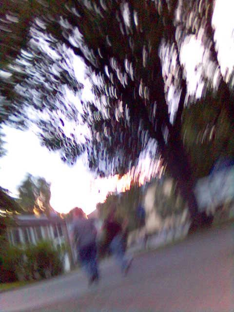 a blurry image of people on a skateboard