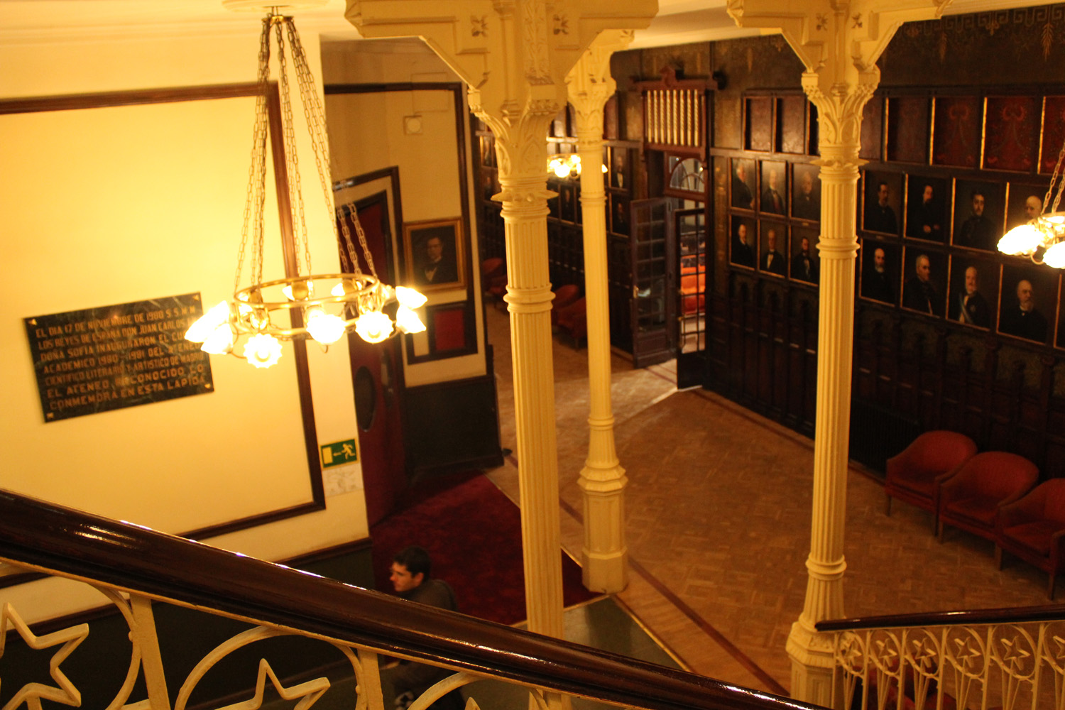 an aerial view looking down on a staircase and seating area