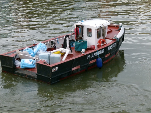 a tug boat in the water ready for a trip