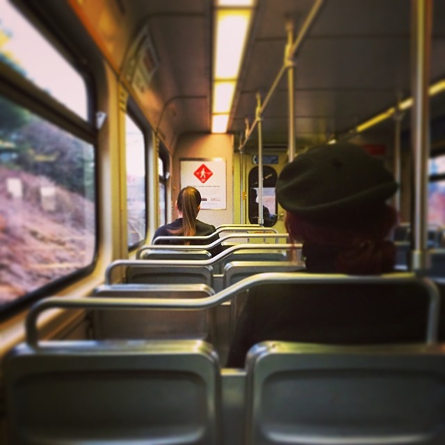 a man sitting in a public transit bus