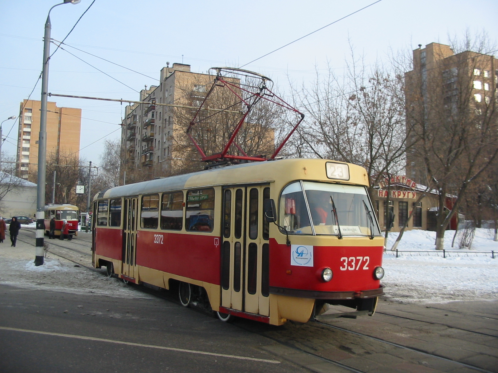 a trolley car that is traveling through the snow