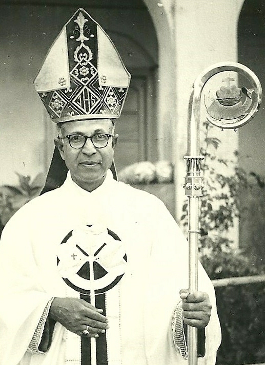 a priest is holding a large sword in his hands