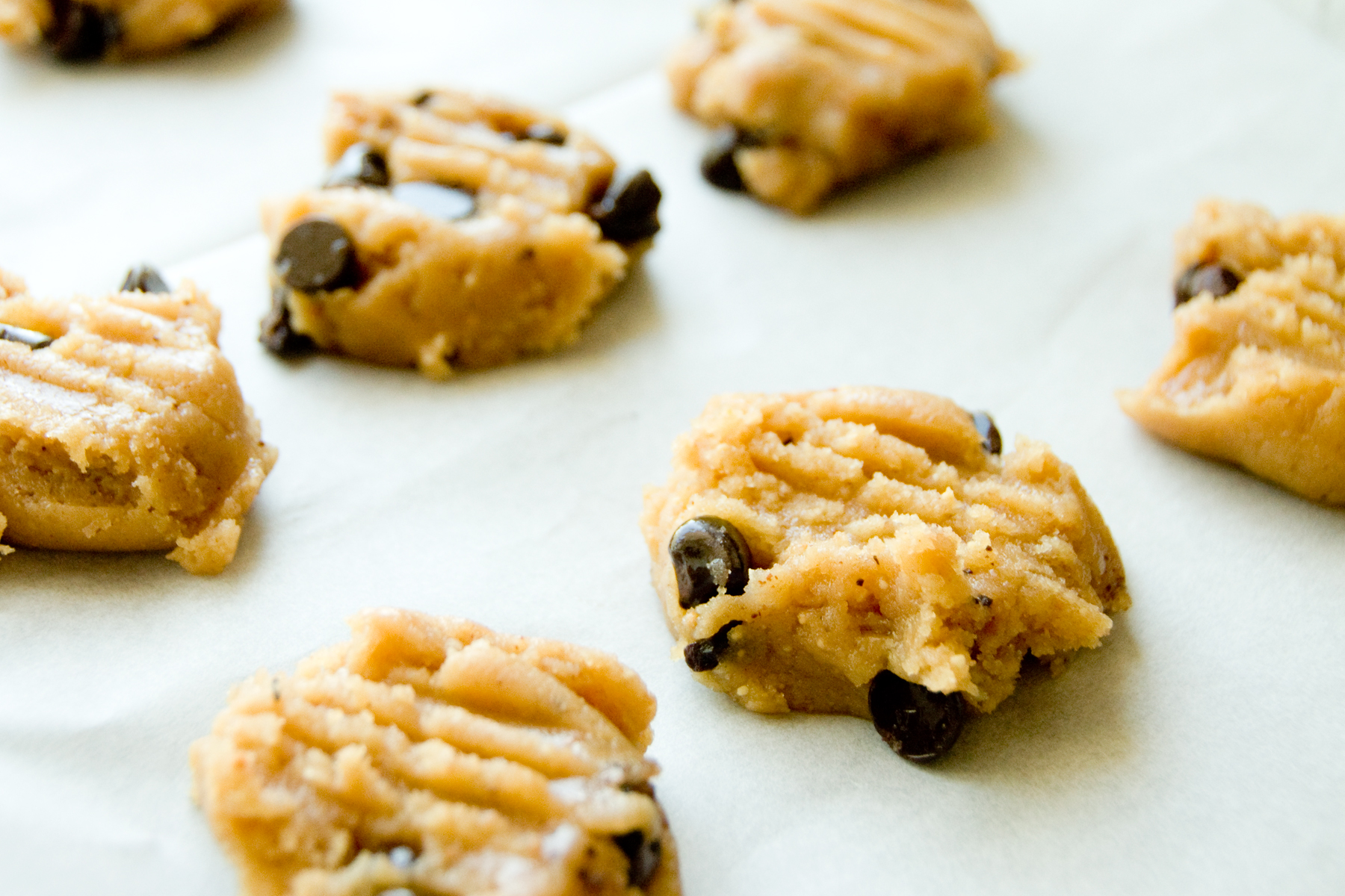 an assortment of cookie cookies laying on top of paper