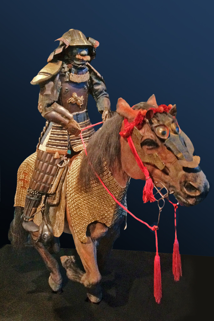 the sculpture is dressed in traditional japanese armor