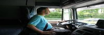 the driver is driving the bus with his equipment