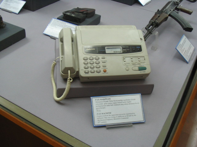 a very old cellphone on display at a museum