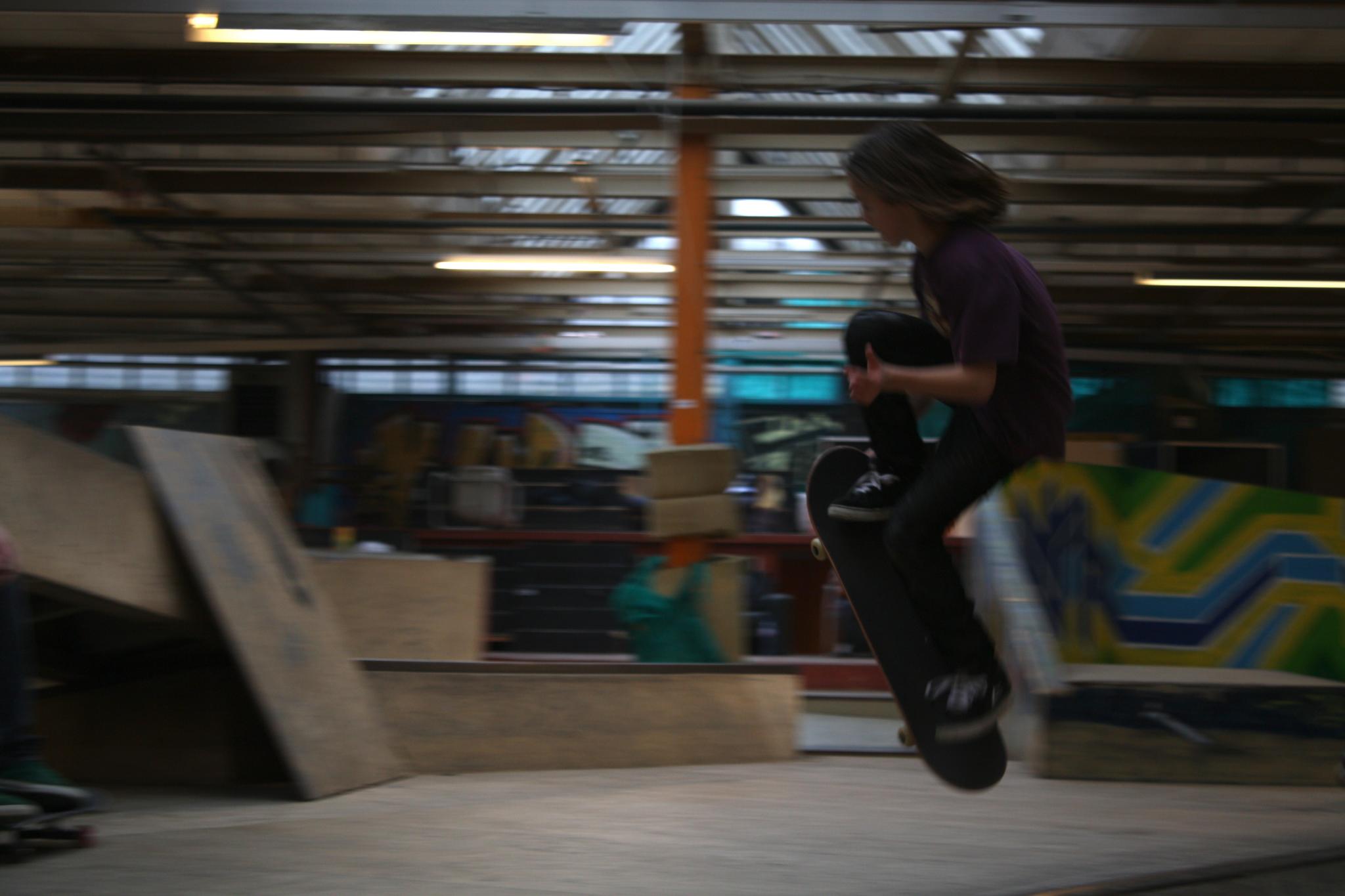 a skateboarder in the air doing a trick in the air