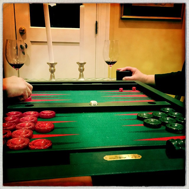 person playing an interactive carrom table game