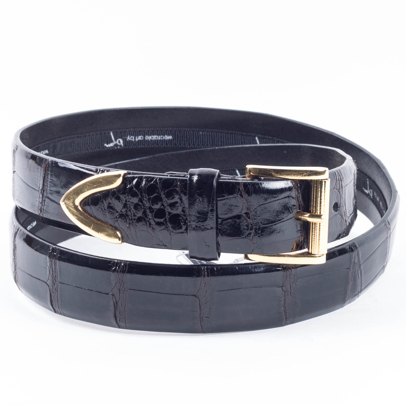 a leather belt with an alligator - embosulated buckle