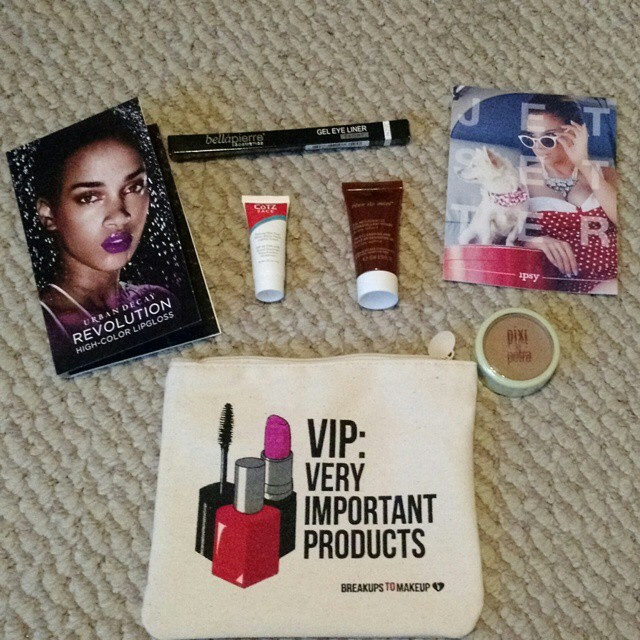 a variety of cosmetics and personal care items laid out