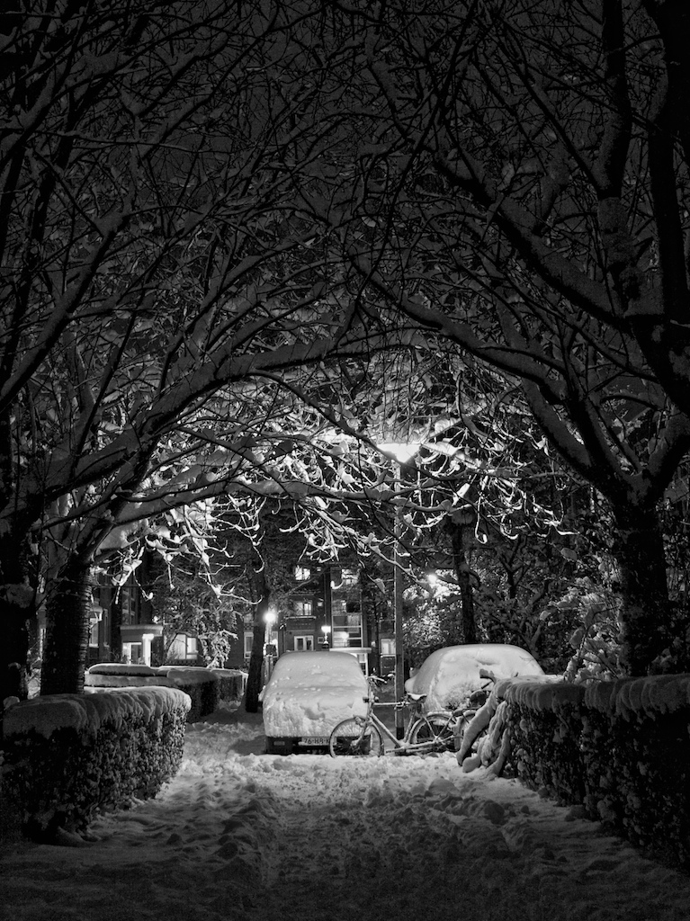 a car parked in the middle of a snowy road