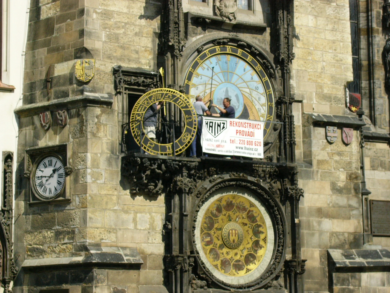 several different clocks decorate an old church tower
