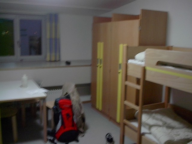 a bedroom with bunk beds in it and some pillows