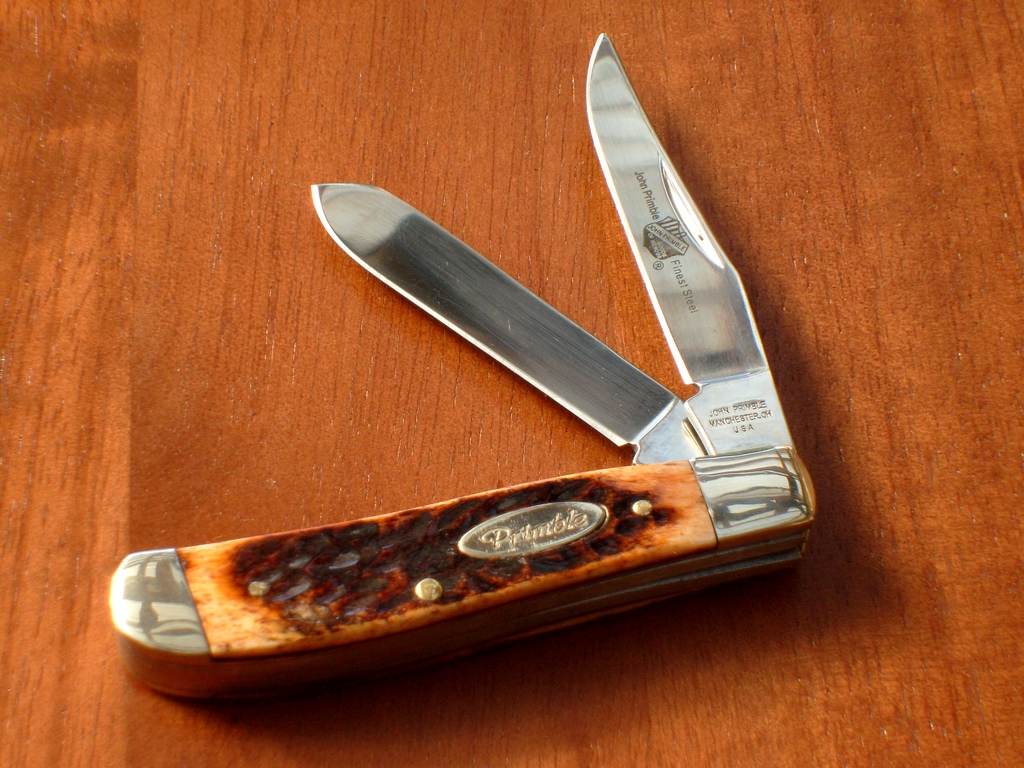 the pocket knife has a wooden decoration