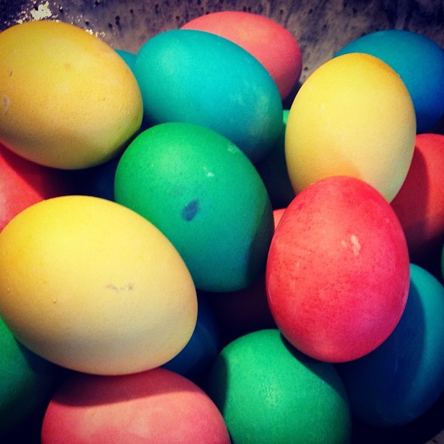 a bowl full of brightly colored eggs