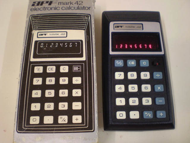 two calculators sitting side by side on a table