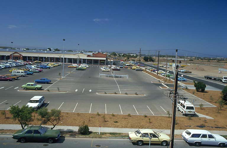 a parking lot with lots of parked cars