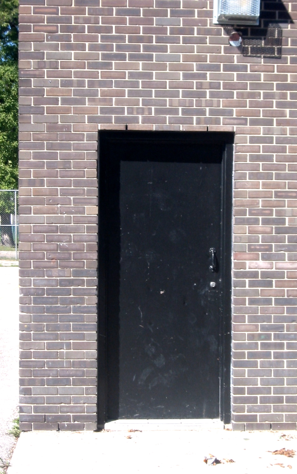 the doorway to a building is closed to let in light