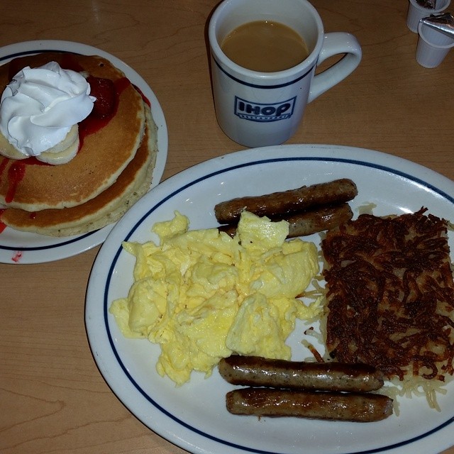 the plates have breakfast foods on them, along with pancakes