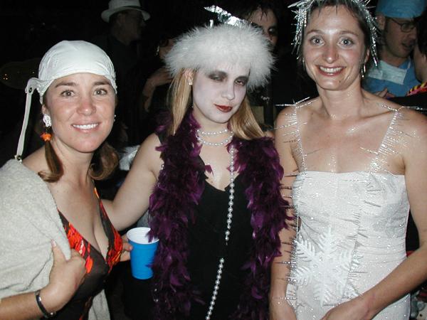 two women dressed up as  and another wearing an animal costume