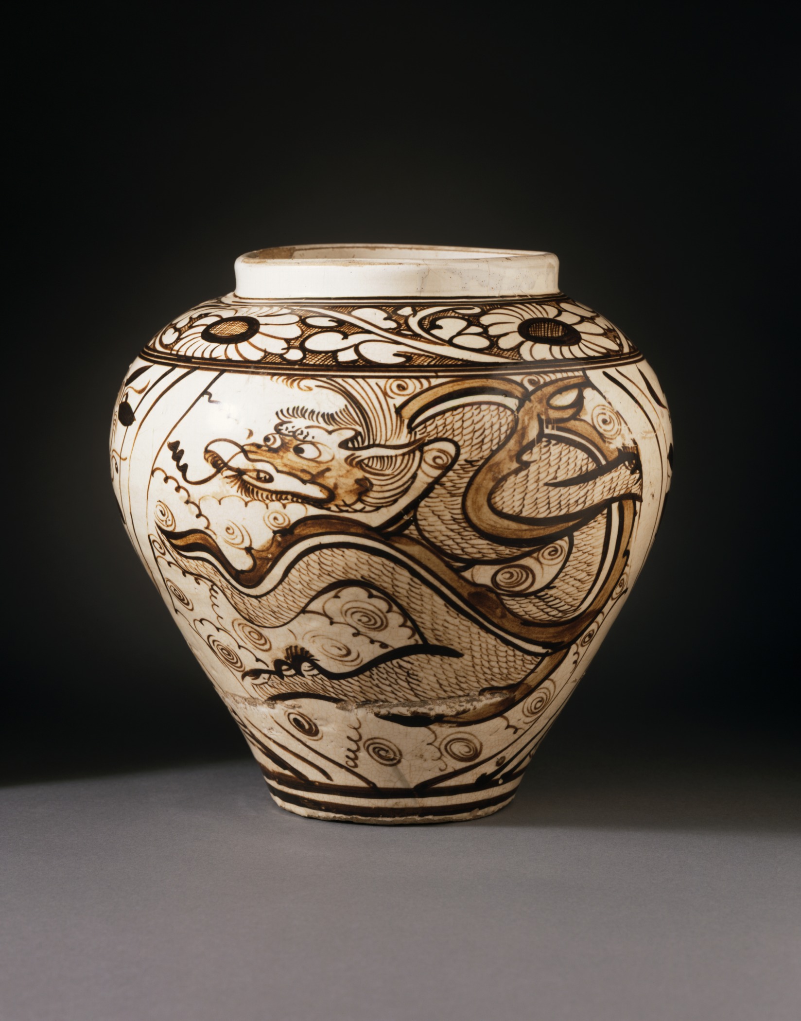 a vase is decorated with ornate designs on it