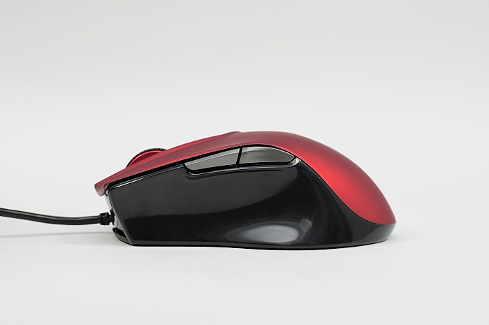 a red and black computer mouse with its light on