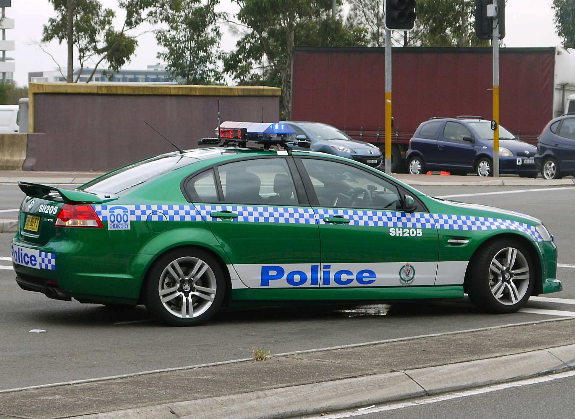 an police car parked on the side of a street