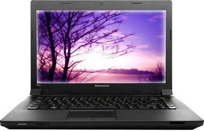 a black laptop with a colorful sky and trees