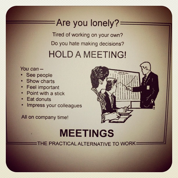 a sign describing meeting where the people meet