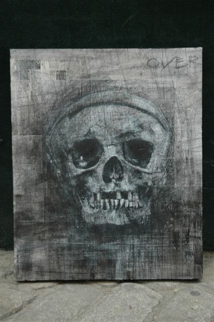 this is a paper cut with black and white paper showing a skull