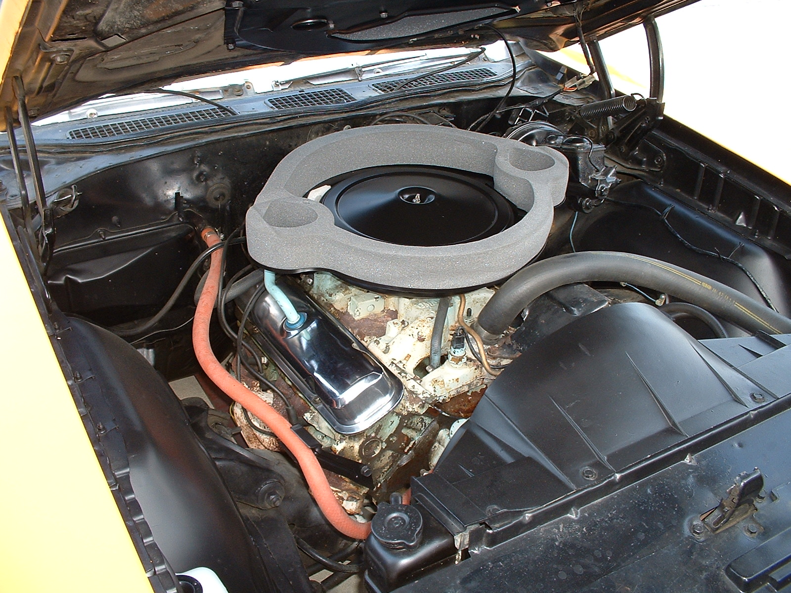 the engine compartment of an automobile that has been broken