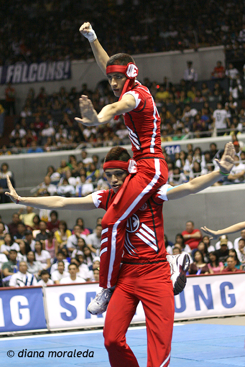 two performers performing for a crowd at a sporting event