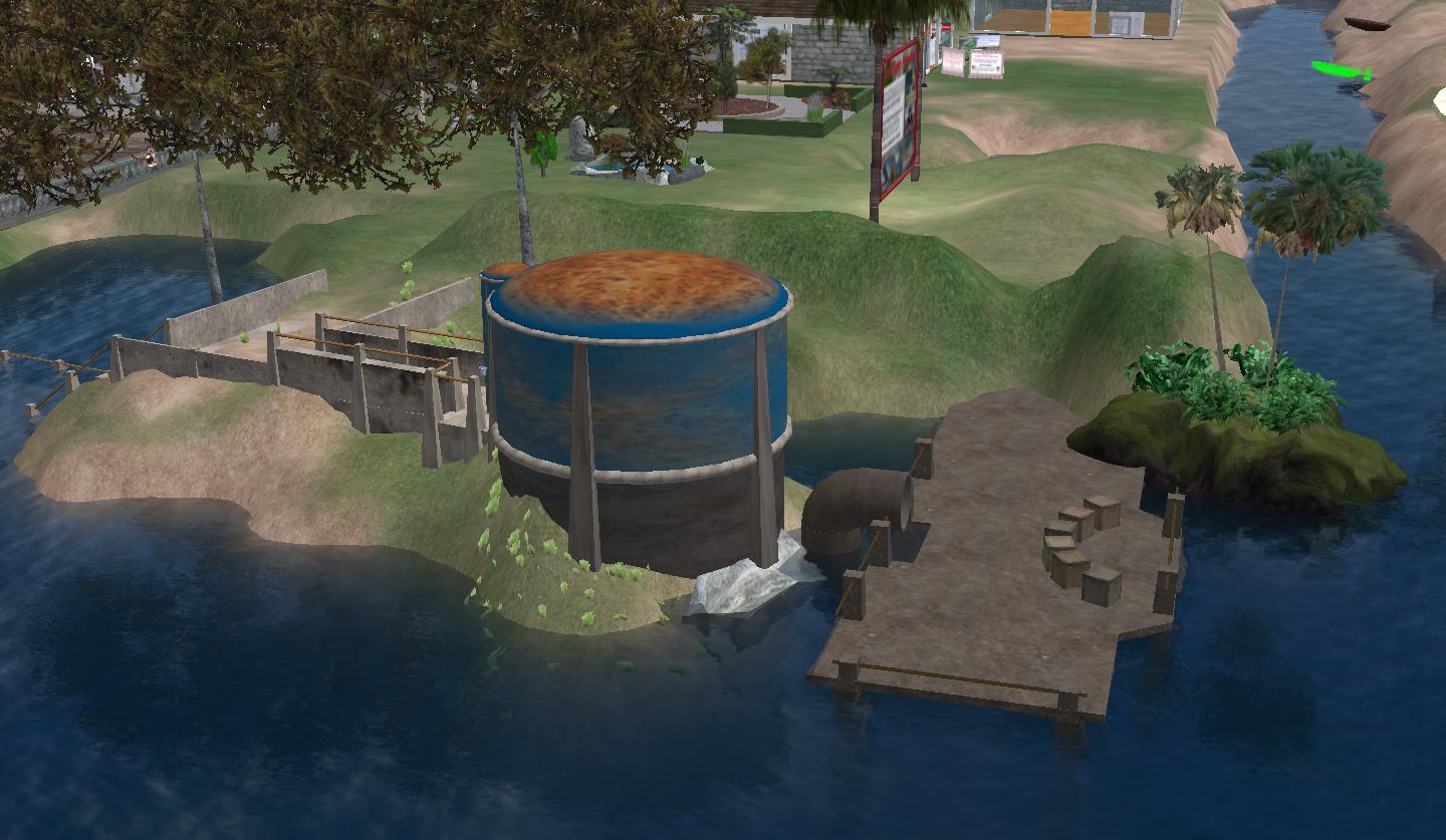 a water tank sits on an island with a dock, grass, and people sitting around it