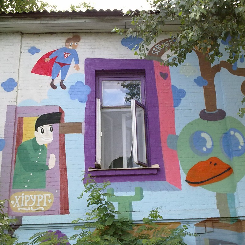 colorful murals painted on the side of a building