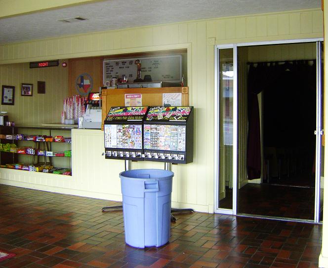 the front entrance to a convenience store with several different menu items