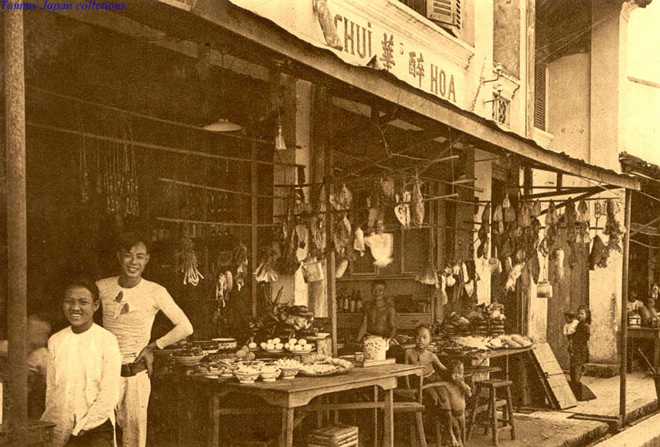 an old po of two people at a market