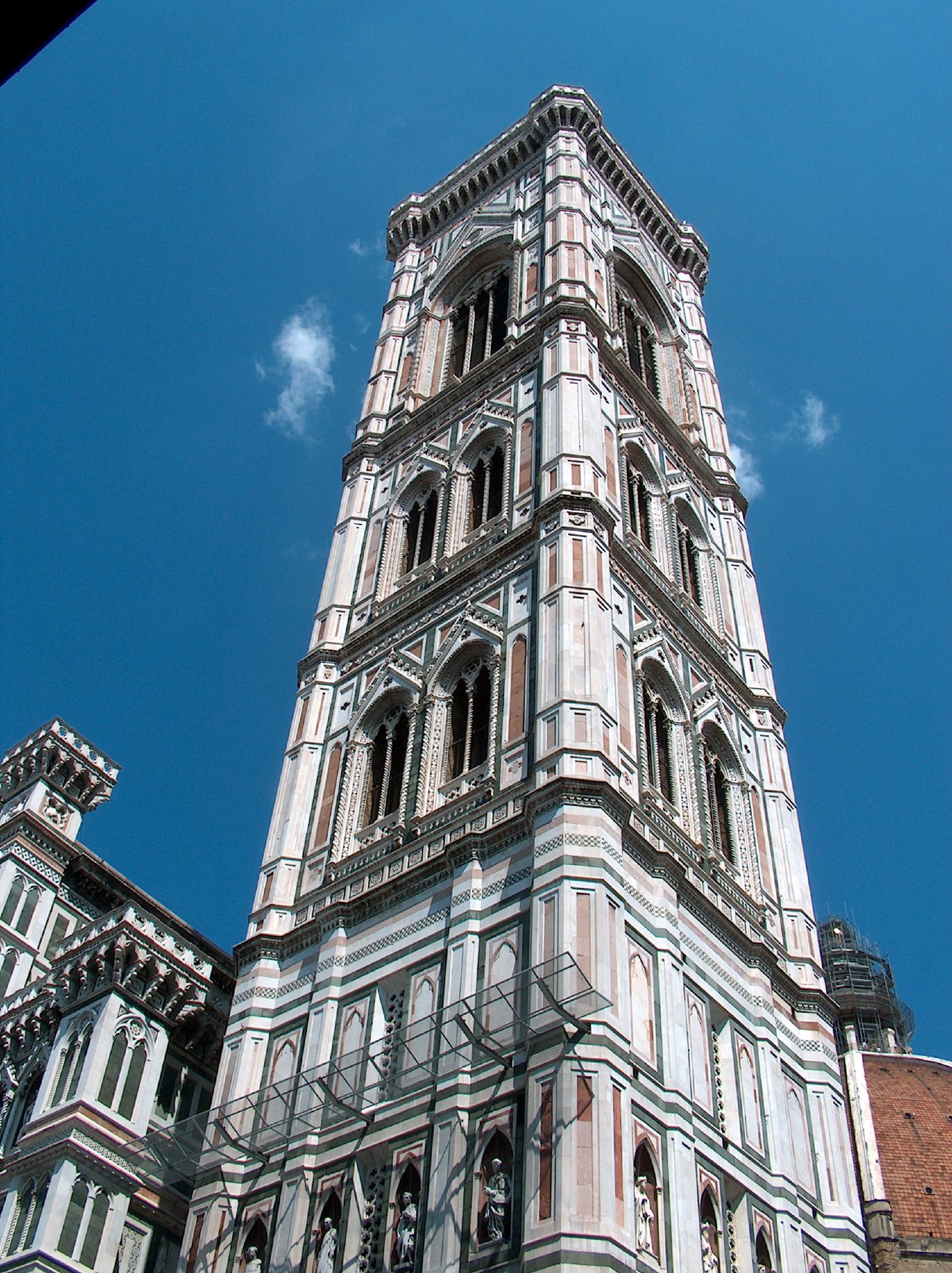 a tower like building with balconies on top