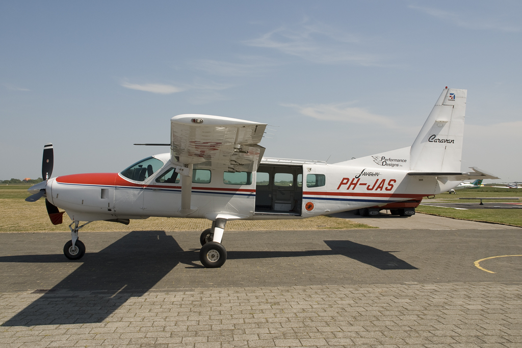 a small propeller airplane sitting on top of an airport tarmac