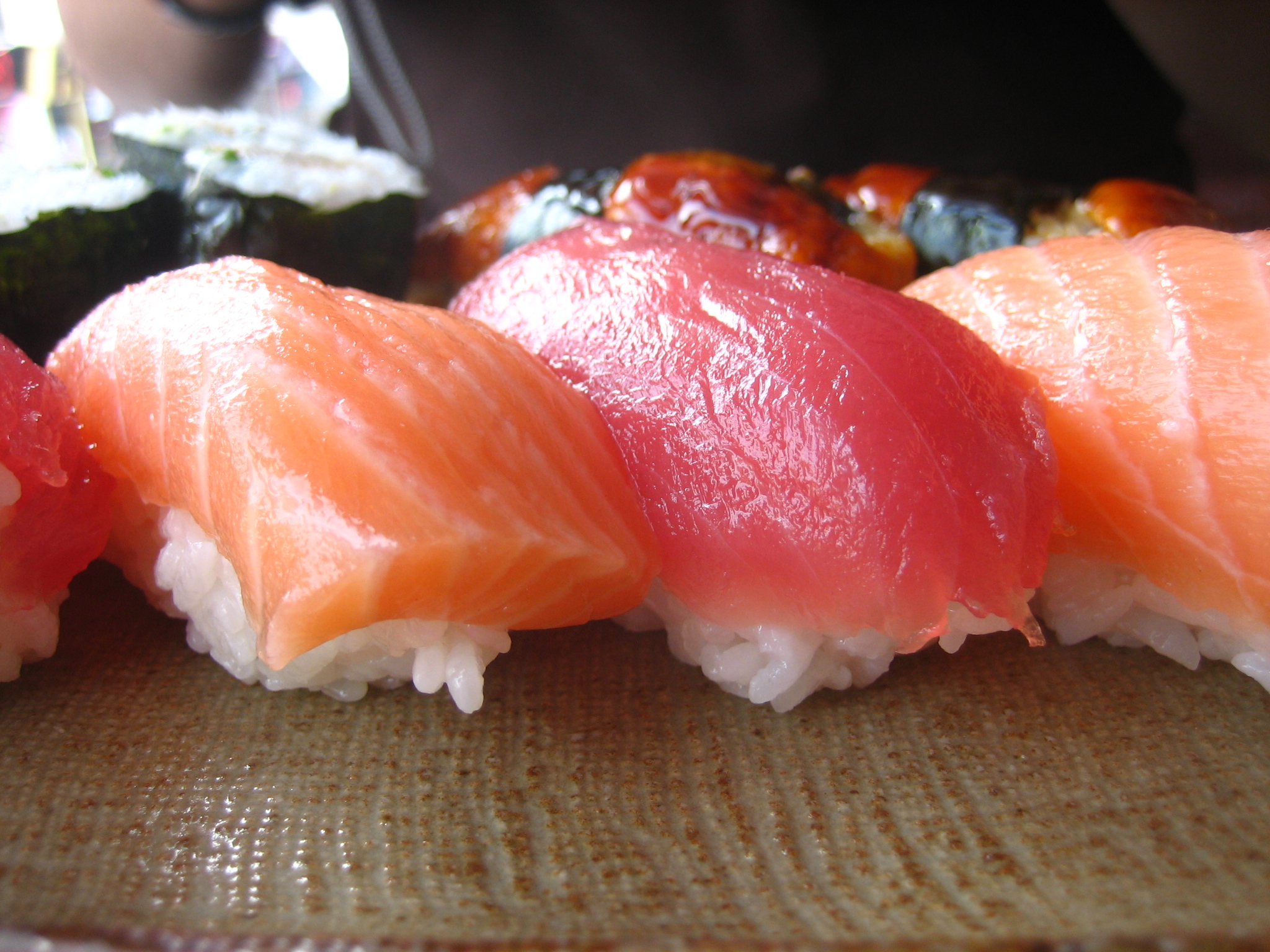 some kind of sushi with different kinds of fish