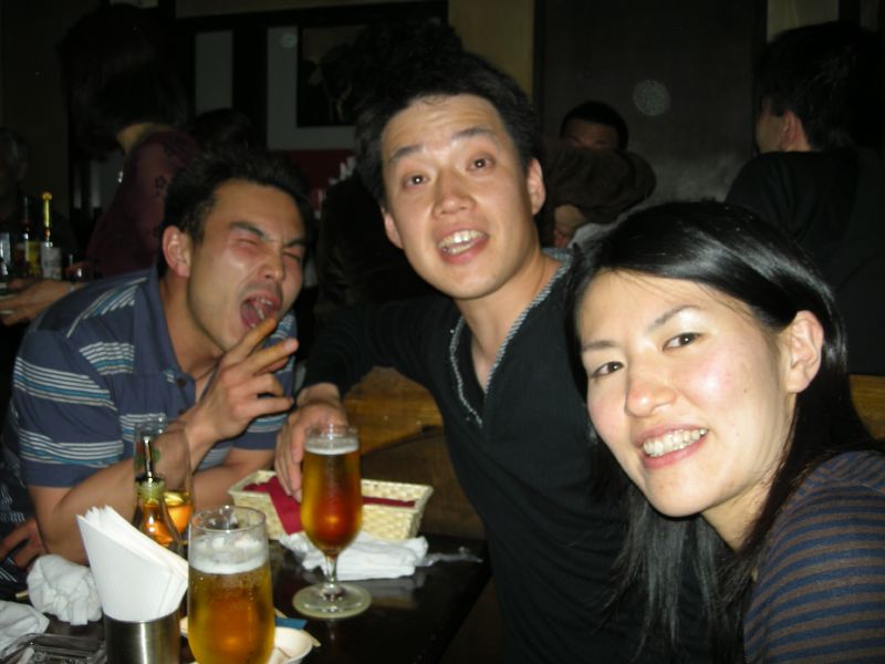 a group of people posing for a picture at a restaurant