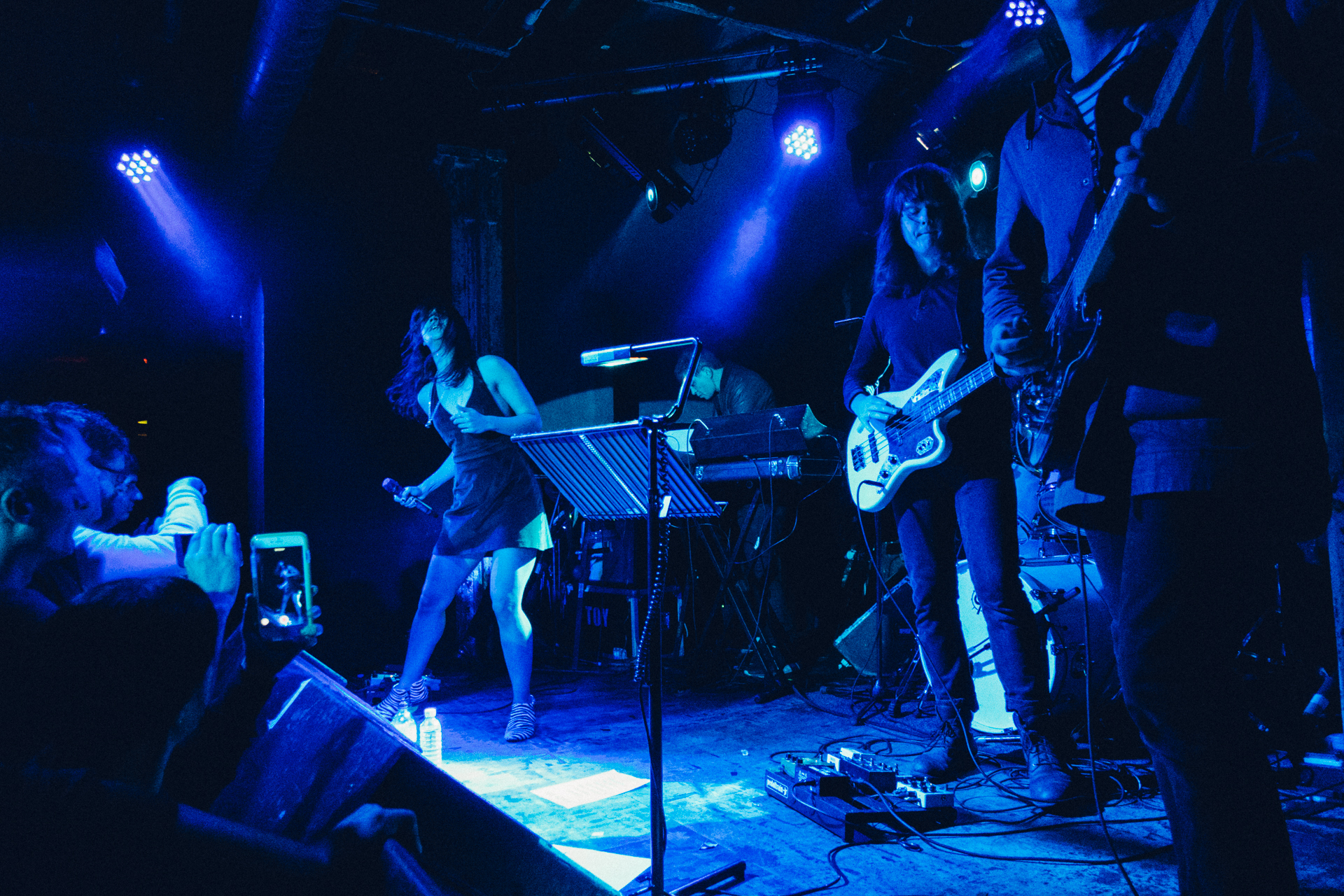 several people playing instruments on a stage