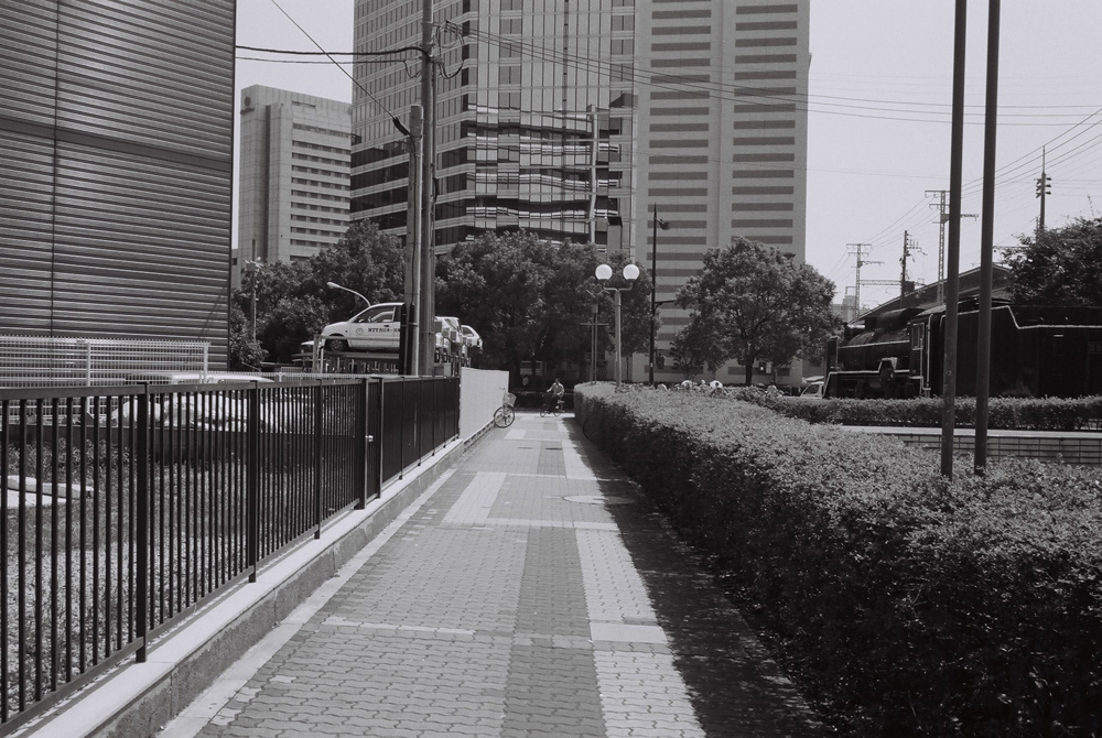 the black and white po shows a street in a city