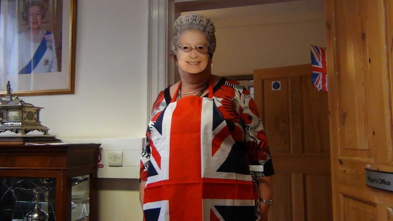 an old woman is dressed in a british flag outfit